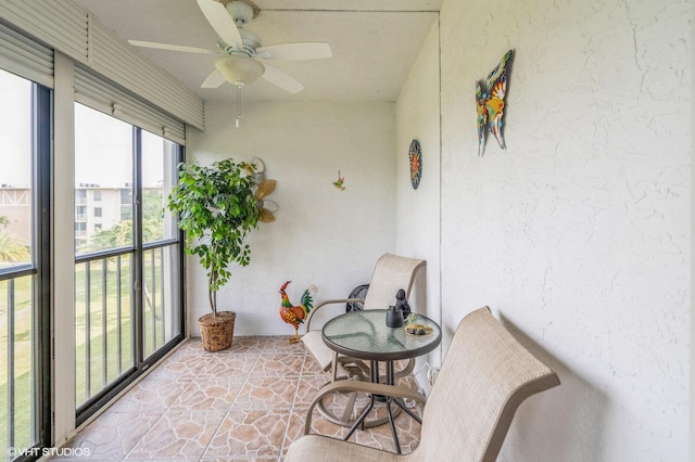 sunroom / solarium with ceiling fan