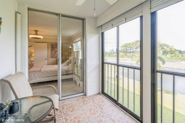 sunroom / solarium with ceiling fan