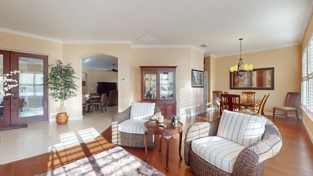 living room featuring crown molding and french doors