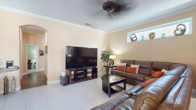 living room with light tile patterned floors, ceiling fan, and ornamental molding