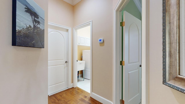 hallway with wood-type flooring