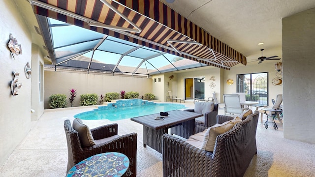 view of pool with a lanai, a patio area, ceiling fan, and an outdoor hangout area