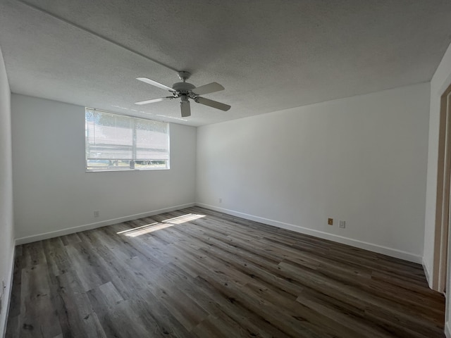 unfurnished room featuring a textured ceiling, dark hardwood / wood-style floors, and ceiling fan