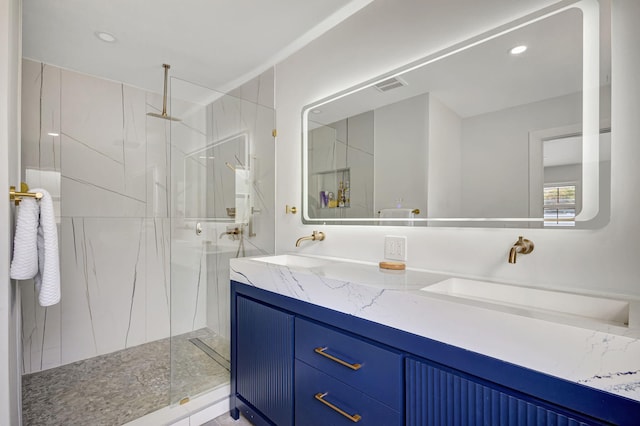 bathroom with vanity and an enclosed shower