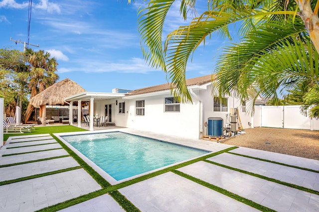 view of pool with central AC unit, a gazebo, and a patio