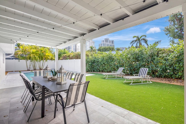 view of patio with a fenced in pool