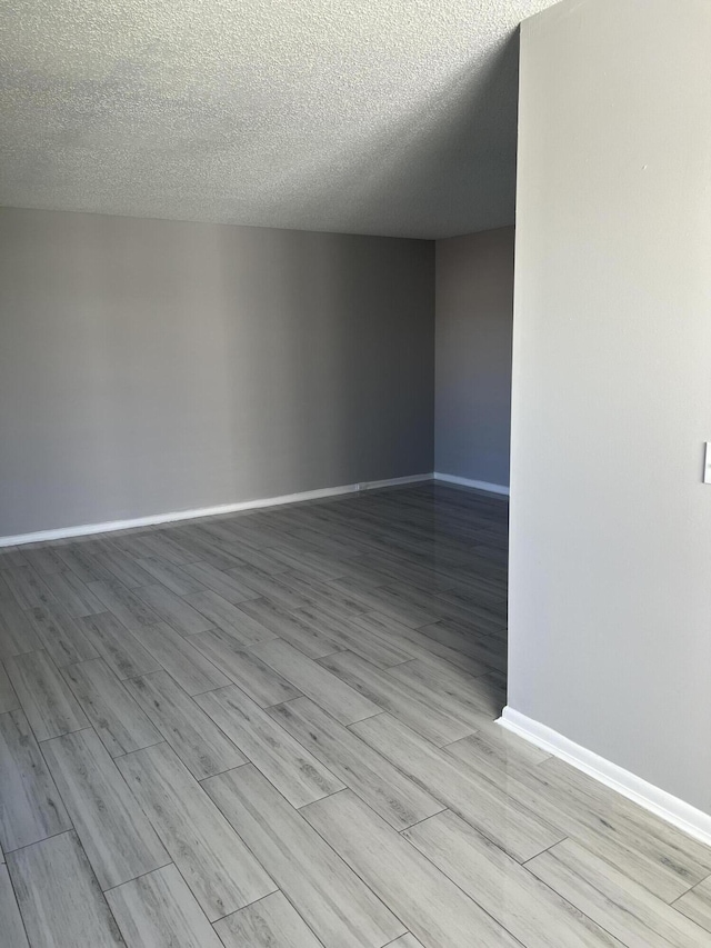 empty room featuring a textured ceiling