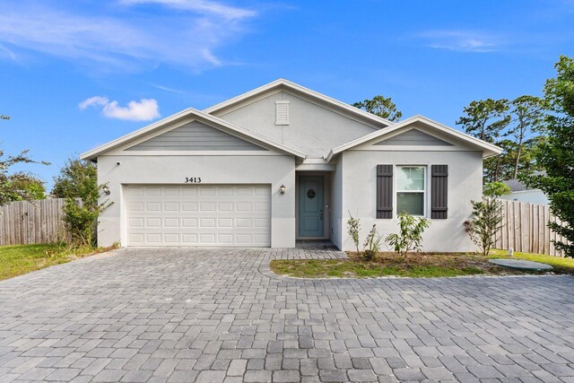 ranch-style home with a garage