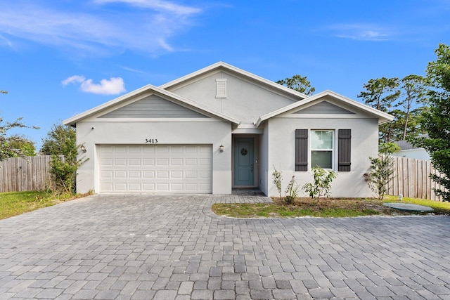 ranch-style home featuring a garage, decorative driveway, fence, and stucco siding