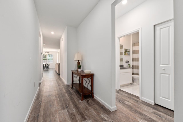 corridor featuring dark wood-type flooring