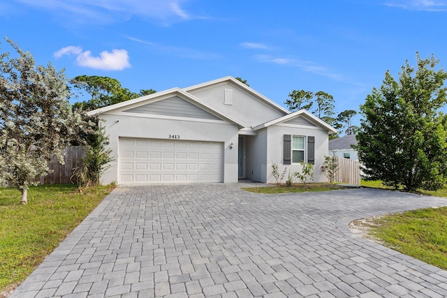 ranch-style home featuring an attached garage, fence, decorative driveway, a front lawn, and stucco siding