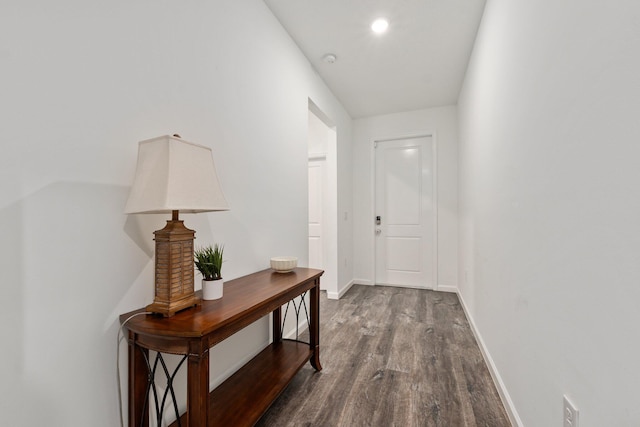 entryway with baseboards and dark wood finished floors