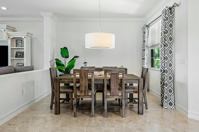 dining space with ornamental molding