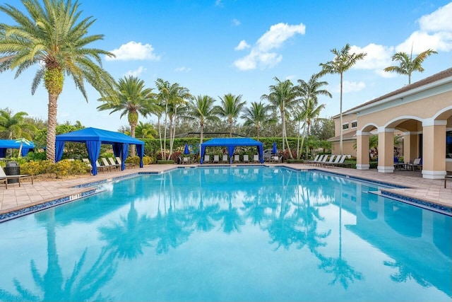 view of swimming pool with a gazebo and a patio