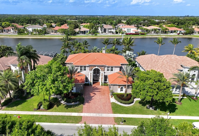 birds eye view of property featuring a water view and a residential view