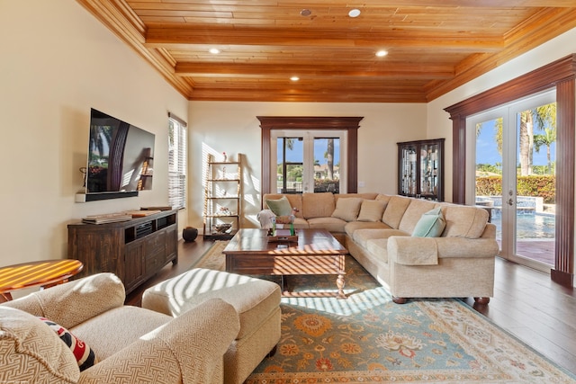 living room featuring beam ceiling, hardwood / wood-style flooring, crown molding, and wooden ceiling