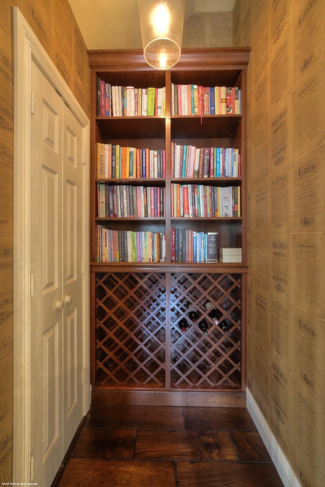 interior space featuring wooden walls and wood finished floors