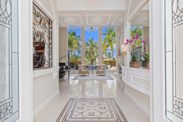 foyer entrance with tile patterned floors and baseboards