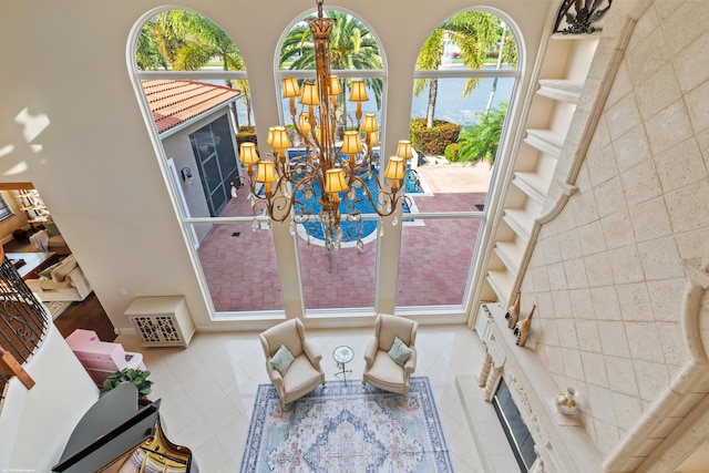 living area featuring a chandelier and tile patterned flooring