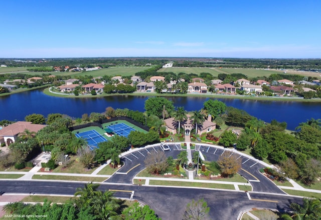 bird's eye view with a water view and a residential view