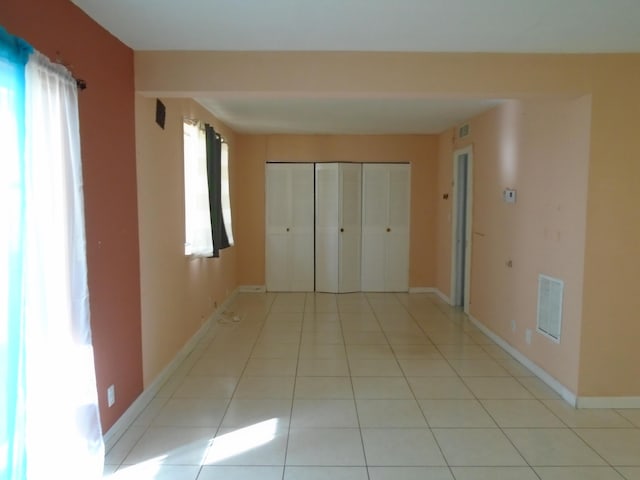 hallway with light tile patterned floors