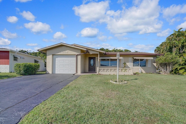 single story home featuring a garage and a front yard