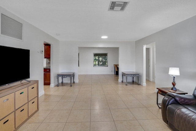 living room with light tile patterned floors