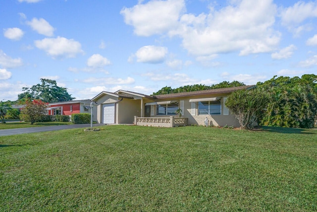 ranch-style house with a front lawn and a garage