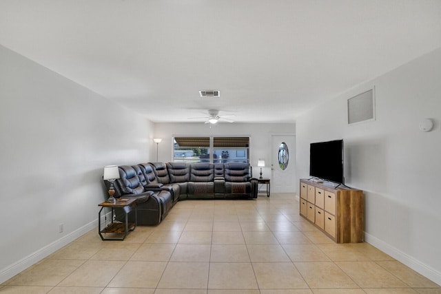 living room featuring light tile patterned floors and ceiling fan