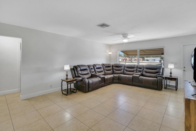 living room with ceiling fan and light tile patterned floors