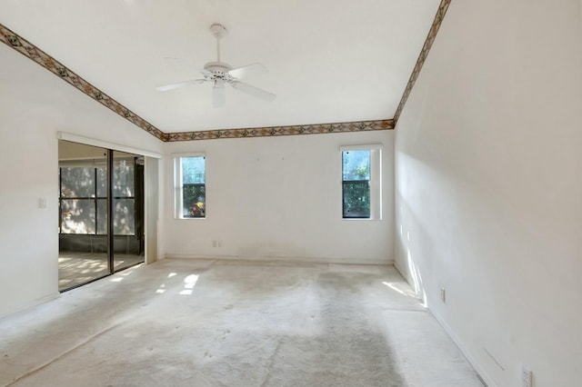 spare room featuring plenty of natural light and ceiling fan