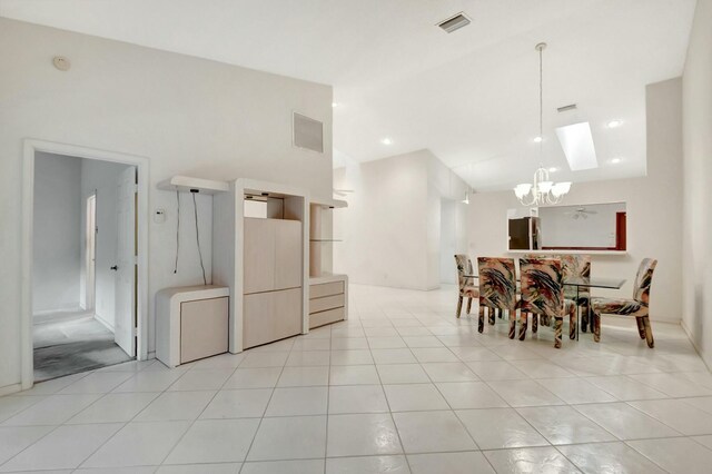 bathroom with tile patterned floors, a shower with door, toilet, and vanity