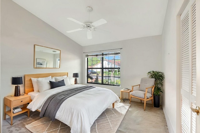 bedroom with light colored carpet, baseboards, a ceiling fan, and vaulted ceiling