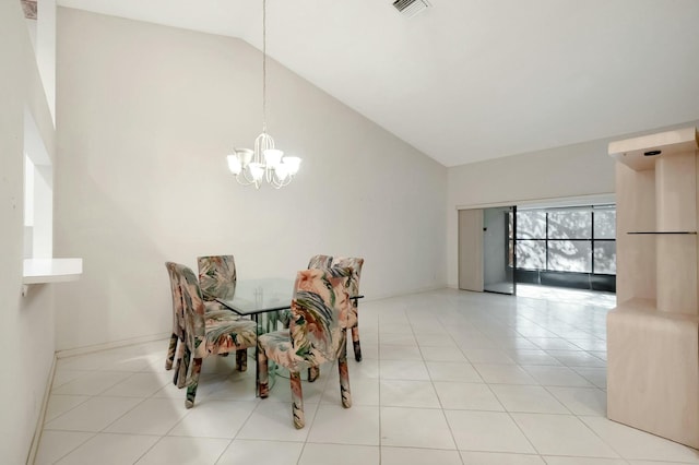 dining space featuring light tile patterned floors, visible vents, high vaulted ceiling, and an inviting chandelier