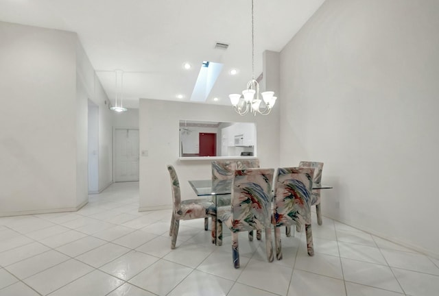 tiled dining room featuring visible vents and a chandelier