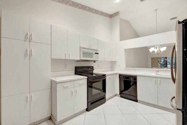 kitchen with black appliances, light countertops, light tile patterned floors, a chandelier, and vaulted ceiling