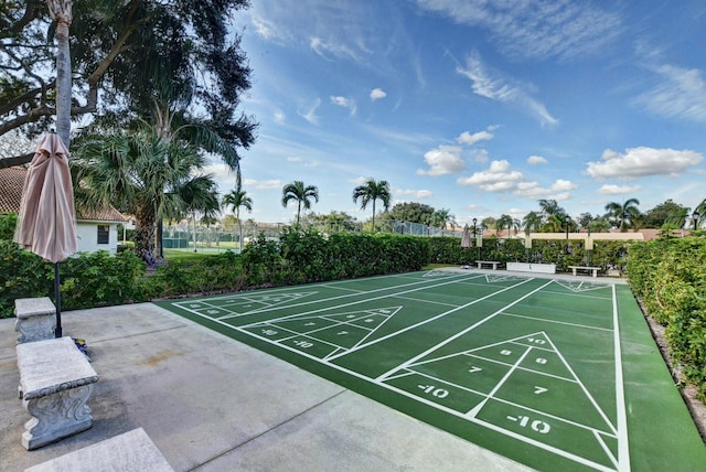 view of home's community featuring shuffleboard