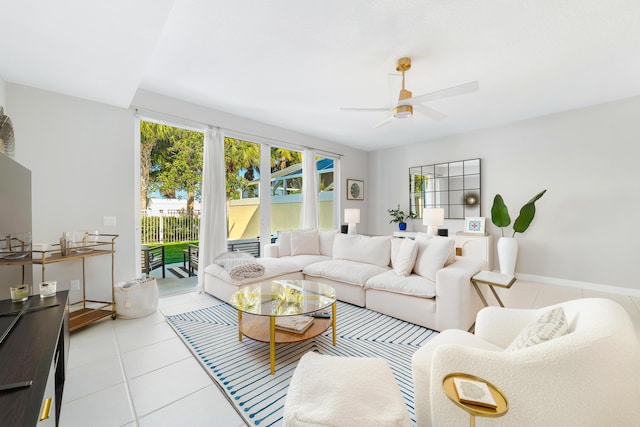 tiled living room with ceiling fan