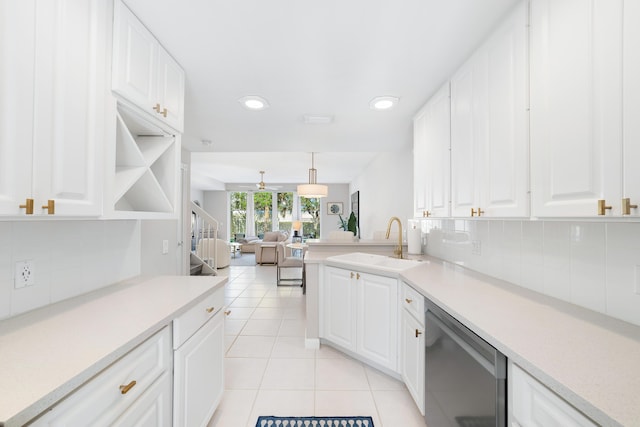 kitchen with white cabinets, dishwasher, sink, and decorative light fixtures