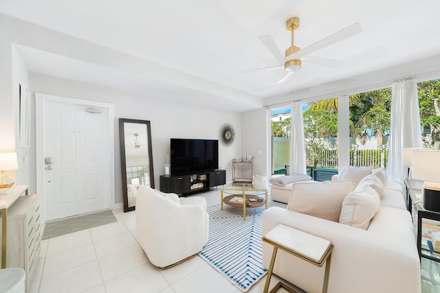 tiled living room with ceiling fan