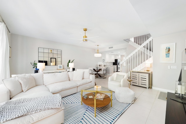 living room featuring ceiling fan and light tile patterned floors