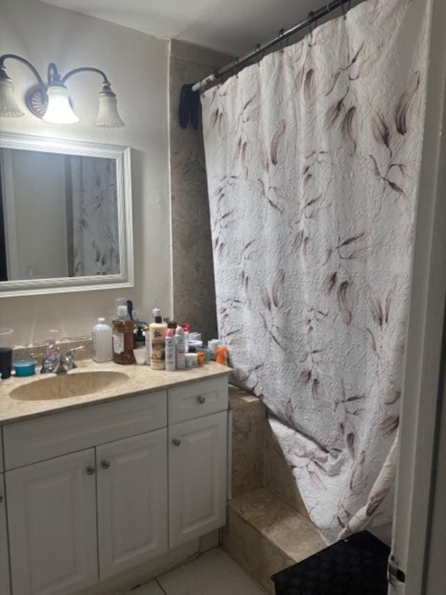 bathroom with tile patterned flooring, vanity, and a shower with shower curtain