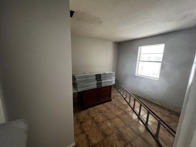 spare room featuring tile patterned floors