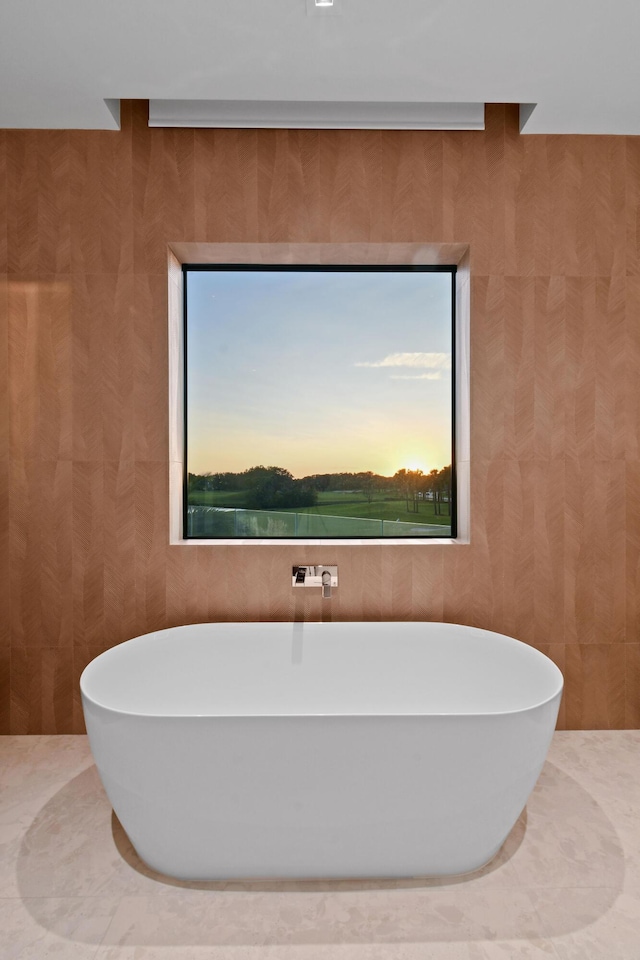 bathroom with a tub to relax in