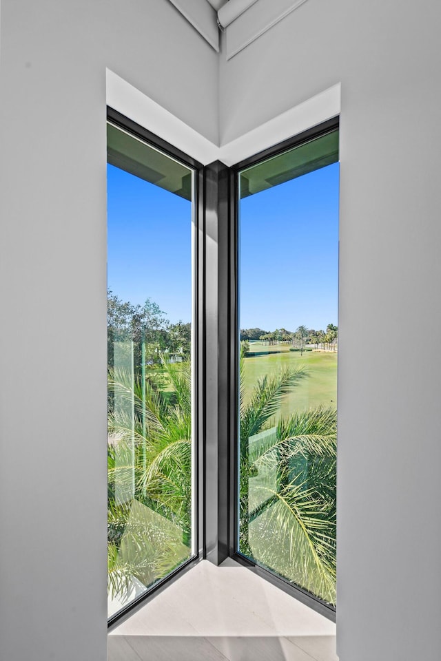 doorway to outside featuring tile patterned flooring and a healthy amount of sunlight