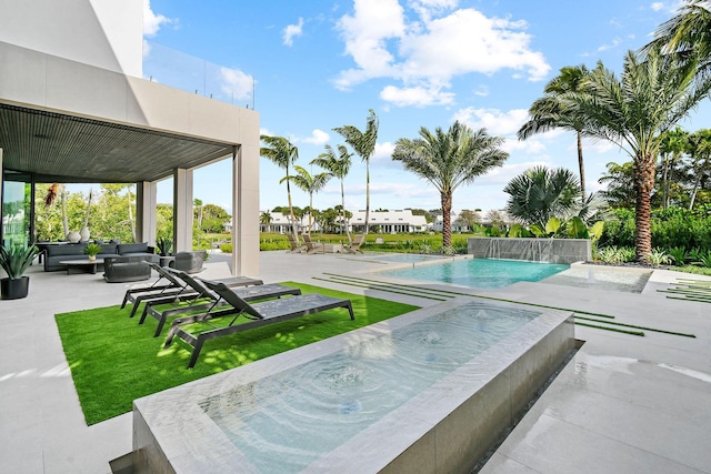 view of pool featuring a patio area and pool water feature