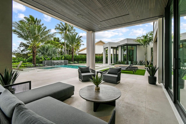 view of patio with outdoor lounge area, pool water feature, and a pool with hot tub