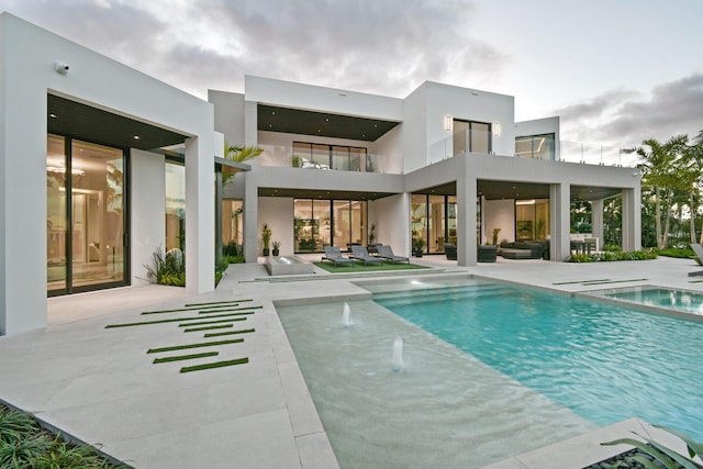 view of pool featuring a patio and pool water feature