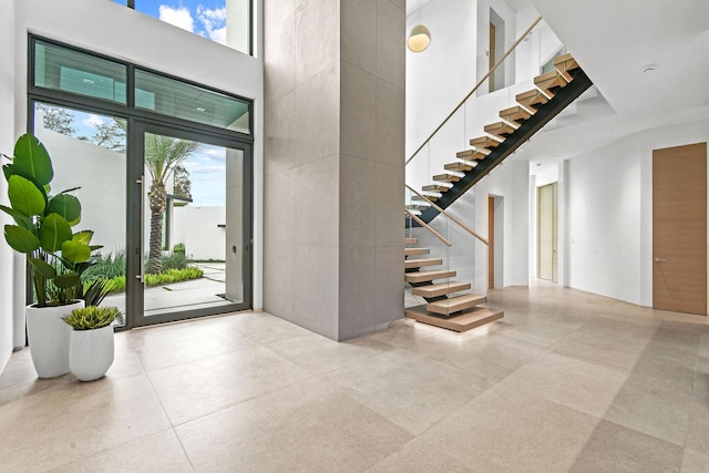 interior space featuring a towering ceiling