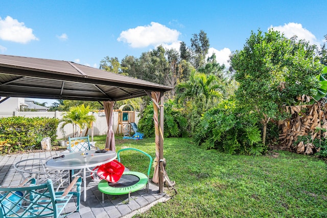 view of yard featuring a gazebo and a patio